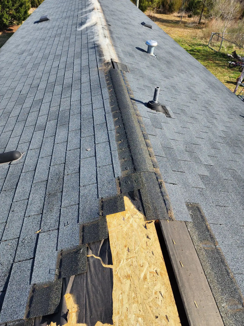 a roof with missing shingles
